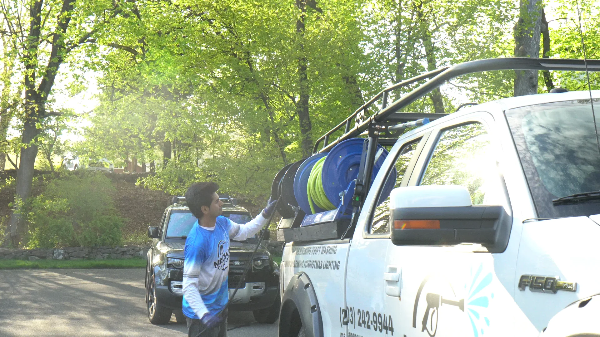 Technician loading hoses at the truck